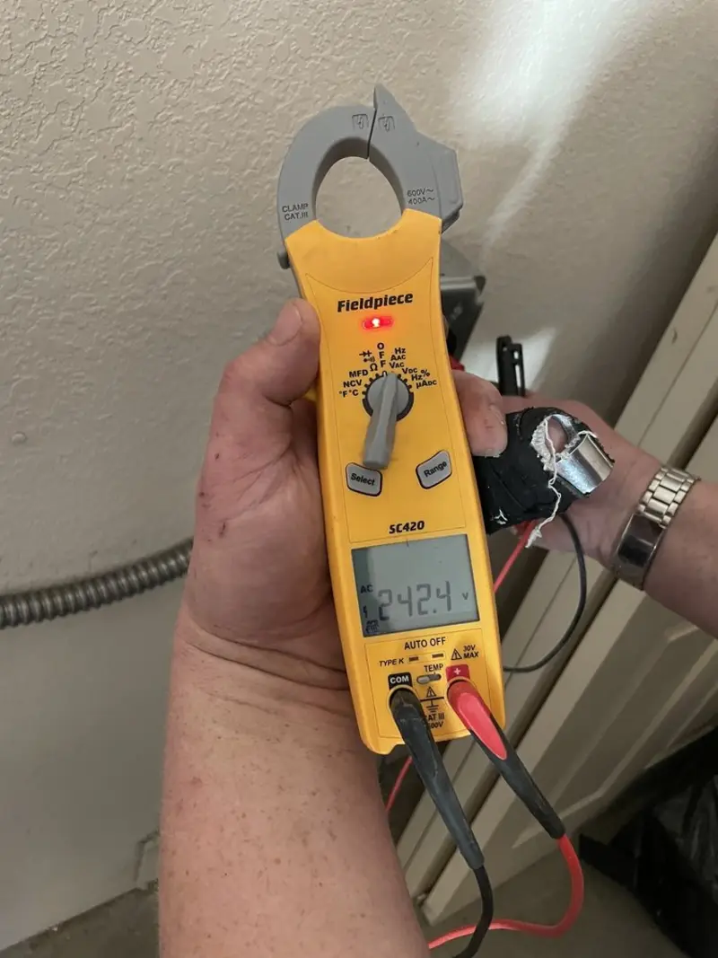 Voltage testing with clamp meter during Electrical Installation Services in Calipatria